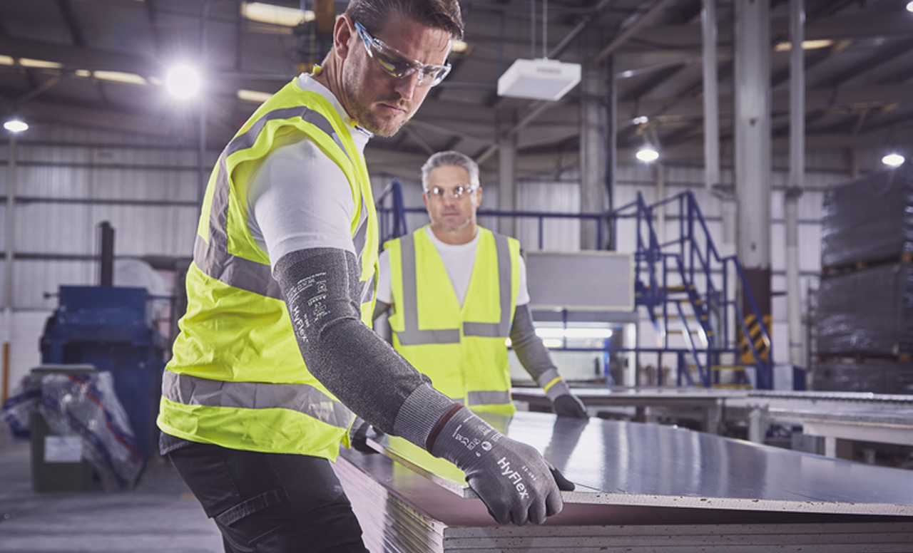 Employees using diverse PPE for workplace safety