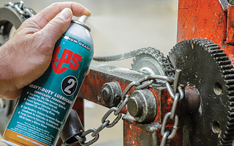 Applying LPS 2 lubricant to gears to ensure smooth performance