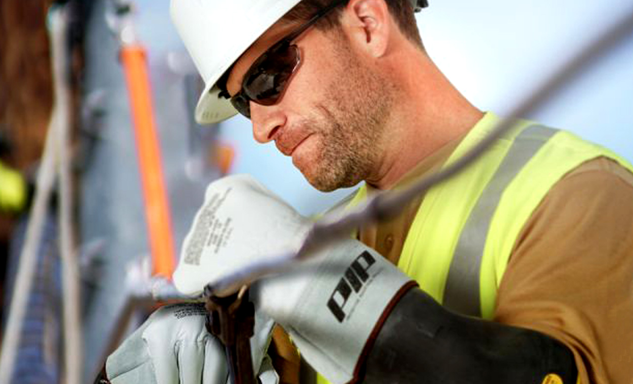 Construction worker wearing PIP gloves and full PPE