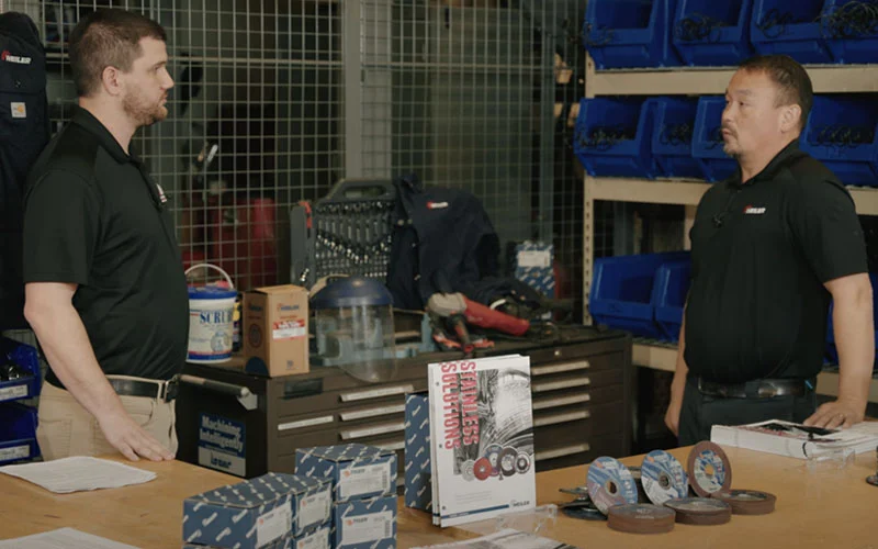 Technician demonstrating how to select the best abrasives for stainless steel