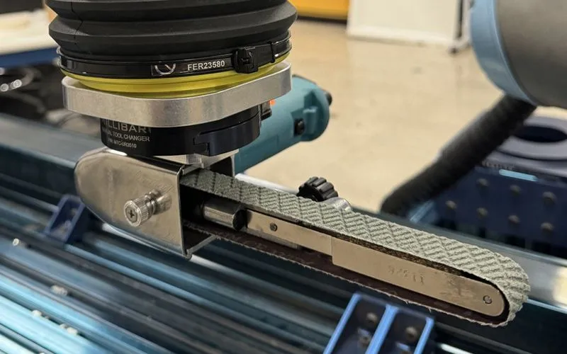 Dynabrade Dynafile end-of-arm tooling mounted on an Autobrade robotic system.