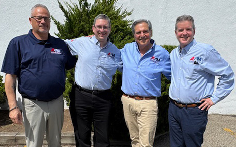 A&M Industrial and Tool-Krib management celebrate joining forces via the acquisition.